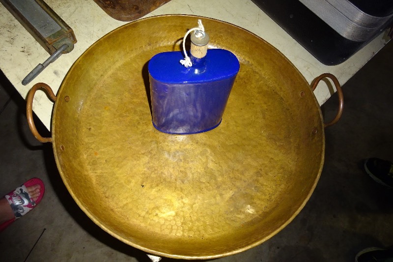 lot 33 image: Copper can with glass bottle