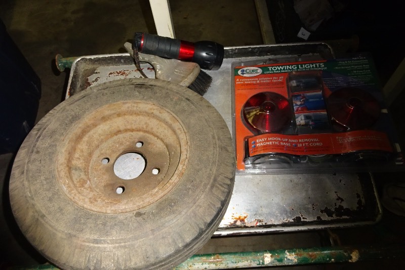 lot 114 image: Trailer Tire, Towing kit, flashlight, brush