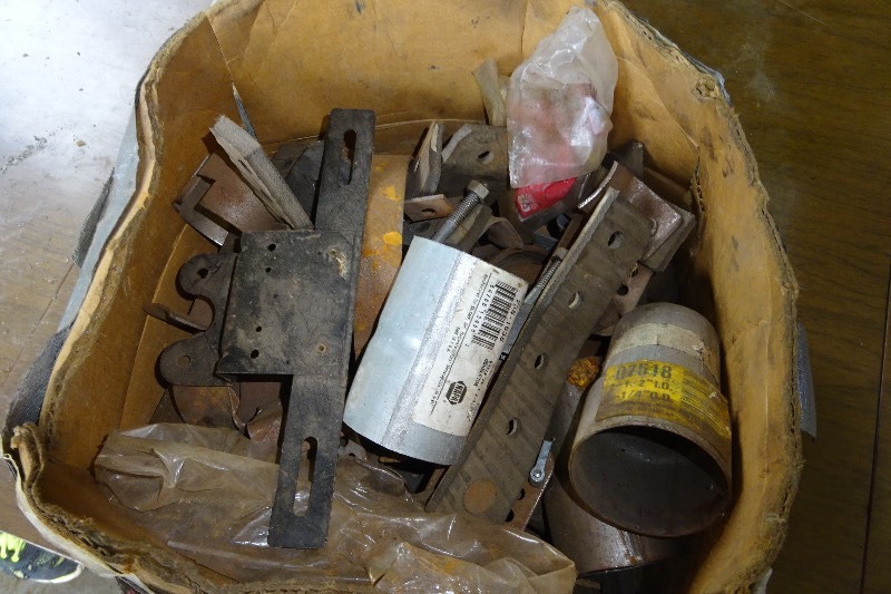 lot 186 image: Muffler brackets and hanger brackets and more