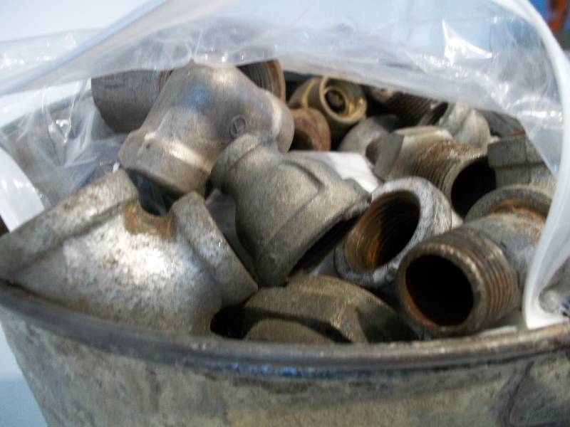 Bucket of Pipe Fittings