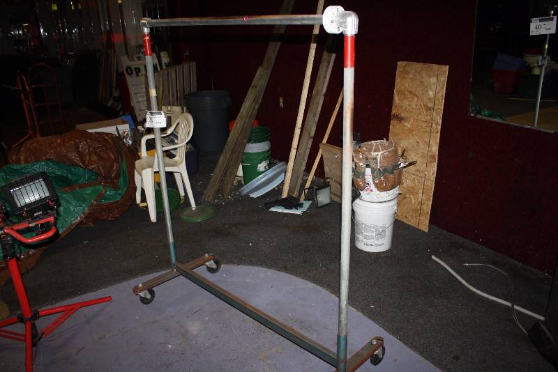lot 28 image: Metal Clothes Rack wWheels 52 x 23 x 62.5.