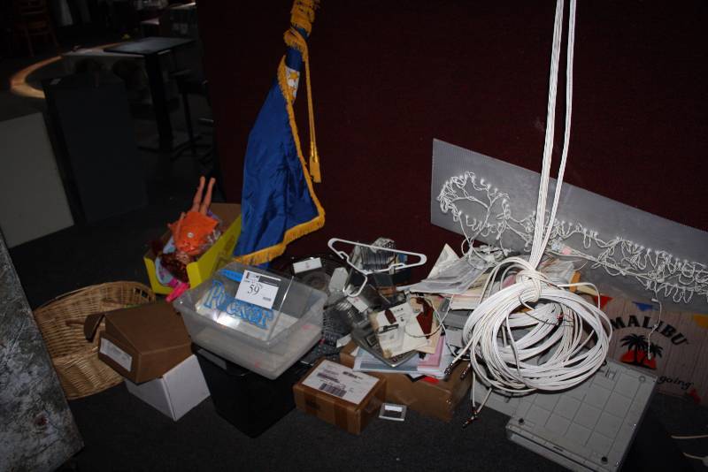 lot 59 image: Corner Lot Including Rolled Up Flag wPole Wicker Basket Miscellaneous Dolls And More.