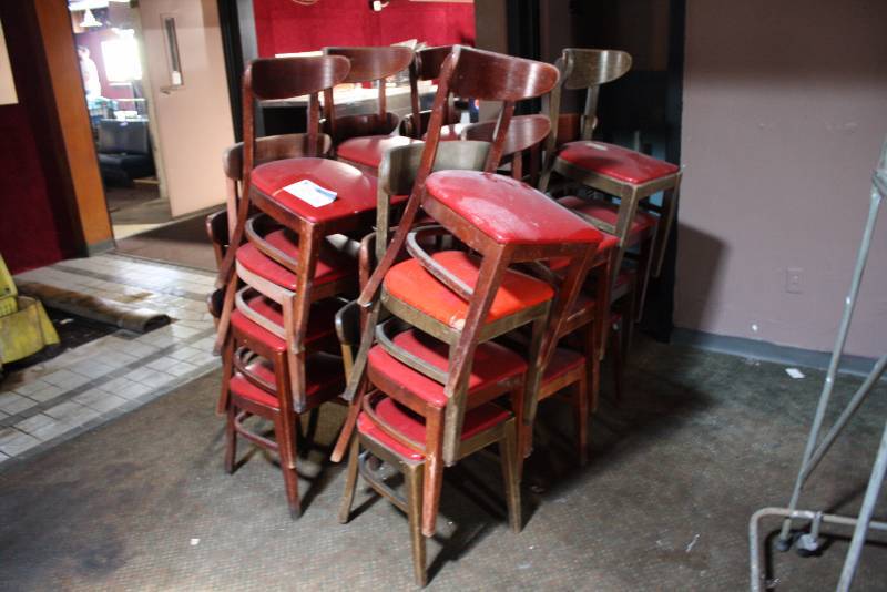 lot 95 image: Lot of (24) Wooden Red Vinyl Chairs wBackings 16.5 x 16.5 x 30.5.