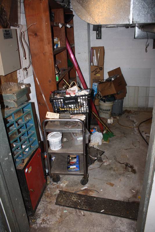 lot 155 image: Room Lot Including Metal Cart Tool Organizer Orange Metal Cupboard And More Does Not Include Furnaces.