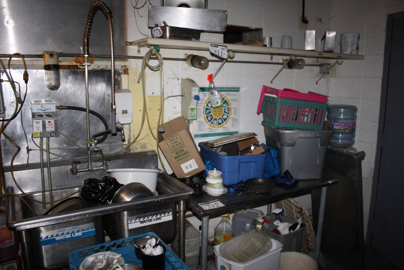 lot 211 image: Kitchen Lot Including Bus Tubs Metal Baking Trays NSF Approved Plastic Ware And More Does Not Include Tables Or Sink.