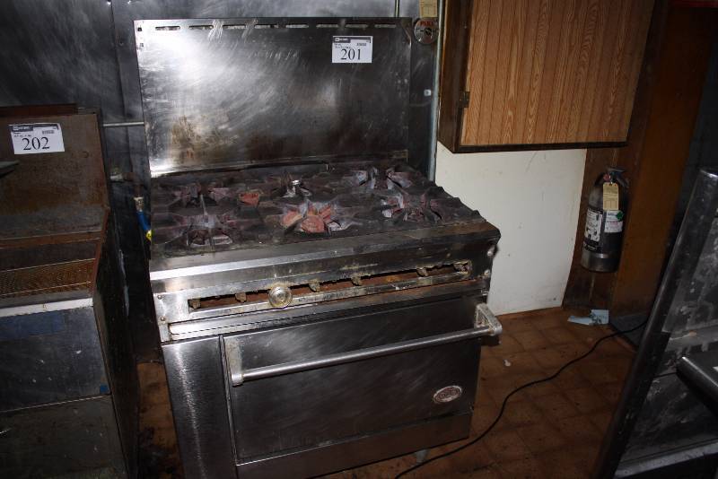 lot 201 image: DCS Brand Range Stove wOven 6 Burners Gas 30 x 36 x 56.5.