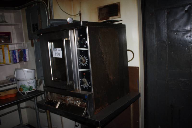 lot 199 image: Commercial Roasting Oven G Logo Includes Grates 32 x 37 x 63.