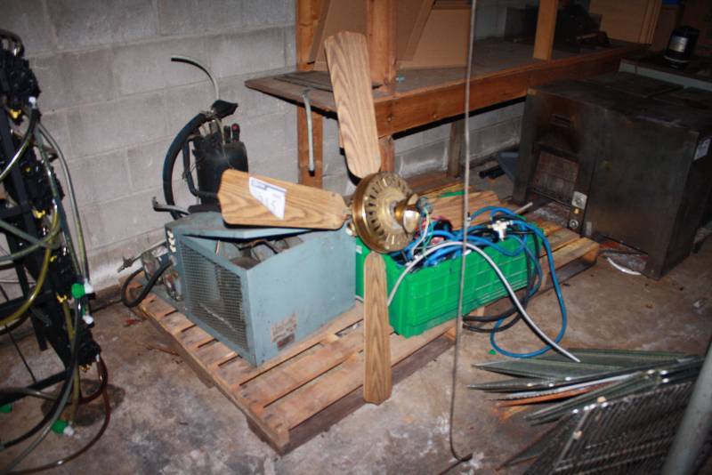 lot 215 image: Pallet Lot Includes Ceiling Fan Miscellaneous CablesCords Plastic Tote And More.