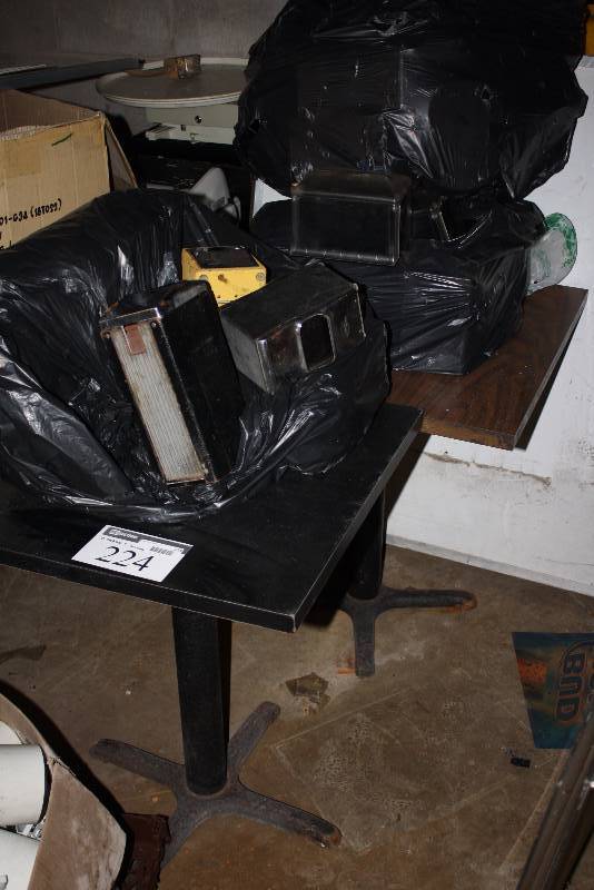 lot 224 image: Lot of (2) Wood Style Tables Includes Contents Napkin Dispensers, And More.