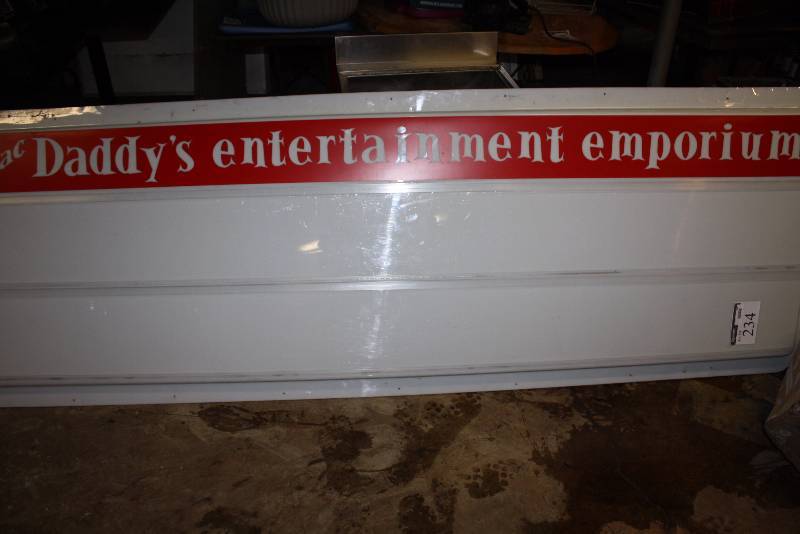 lot 234 image: Mac Daddys Entertainemnt Emporion Sign WhiteRed Plastic 36 x 108.