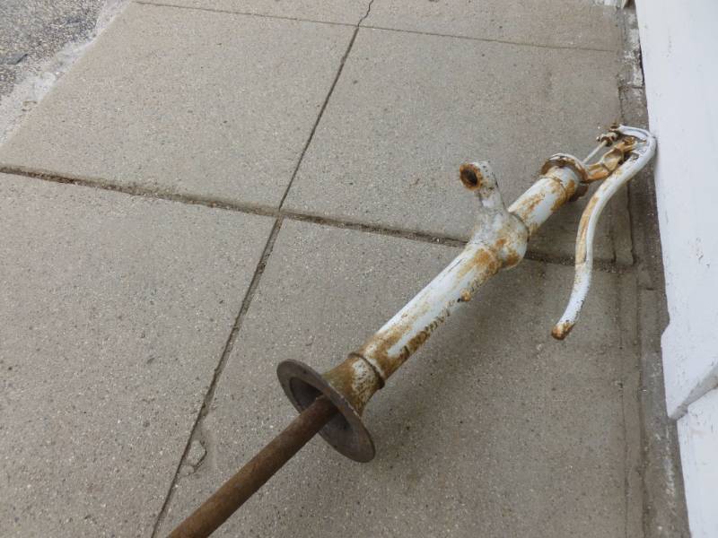 lot 8 image: Vintage Red Jacket Hand Pump