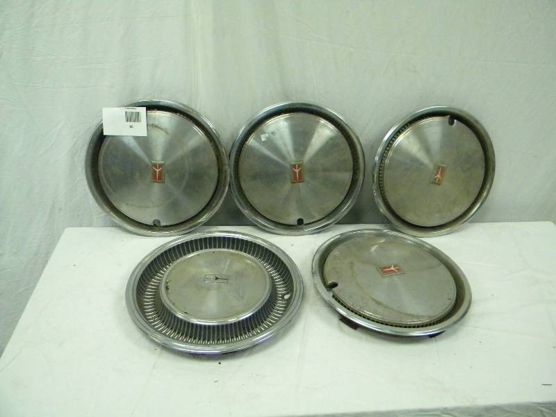 lot 95 image: Vintage Oldsmobile Hub Caps