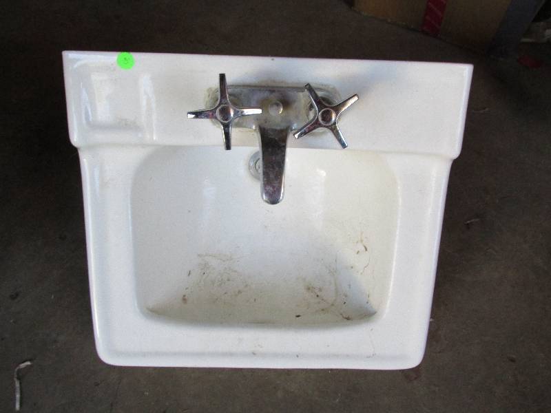 Sink with faucet and drain...