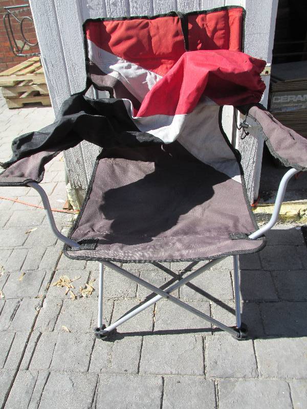 Red and black folding camp chair...