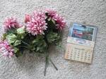 lot 146 image: Silk flowers and a 1967 calendar...
