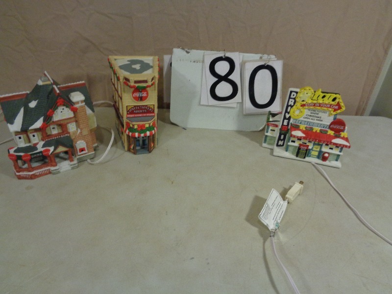 lot 80 image: Coca Cola Light Up Porcelain Christmas Collector Houses