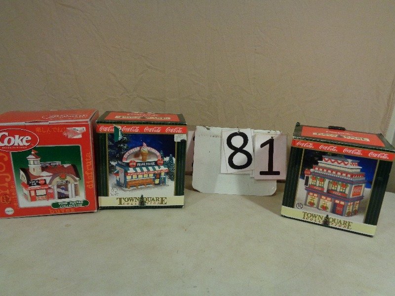 lot 81 image: Coca Cola Light Up Porcelain Christmas Collector Houses