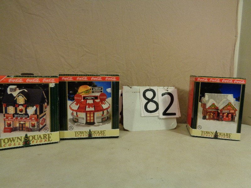 lot 82 image: Coca Cola Light Up Porcelain Christmas Collector Houses