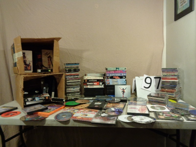 lot 97 image: Dvds, CDs, and VHS Tapes.