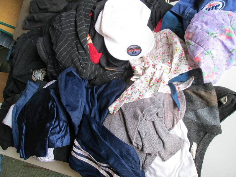 Lot of sports shorts, shirts, caps ...