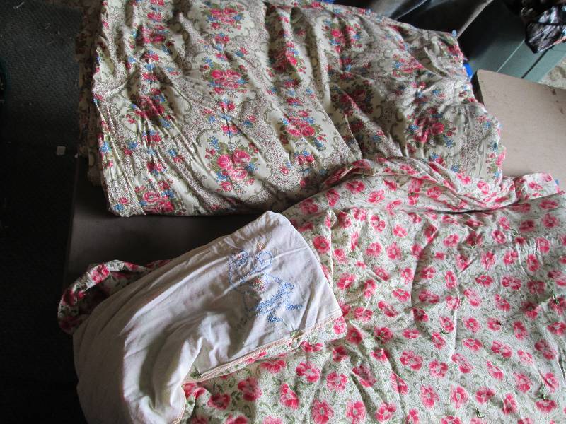 Lot of quilts and blankets, one has...