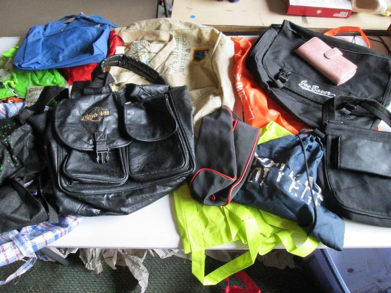 Lot of purses, and bags...