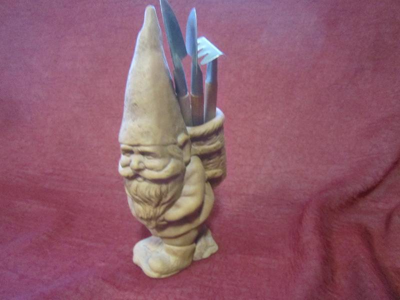 Gnome with garden tools