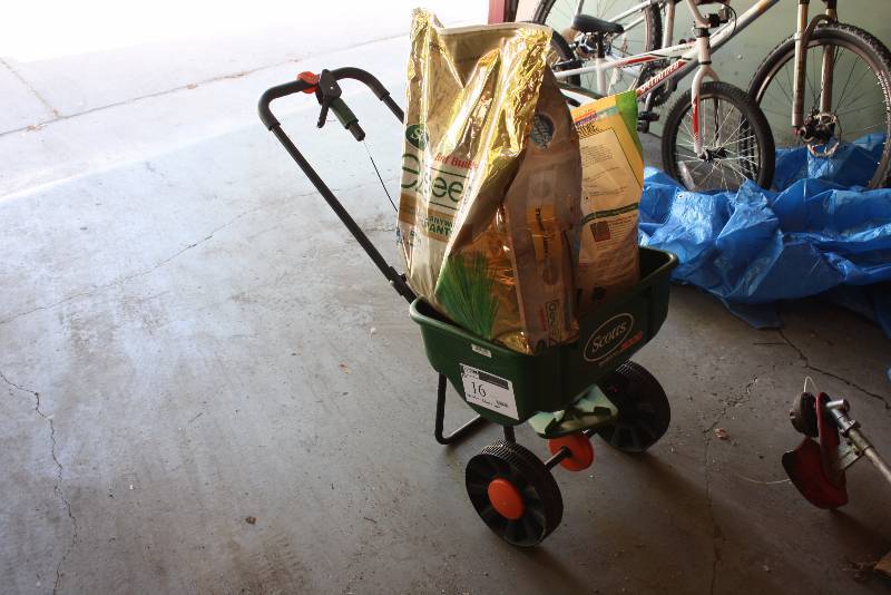 lot 16 image: Lot of (3) Including Scotts Seeder wWheels Bag of Lawn Restore Seed Bag of Lawn E-Z Seed.