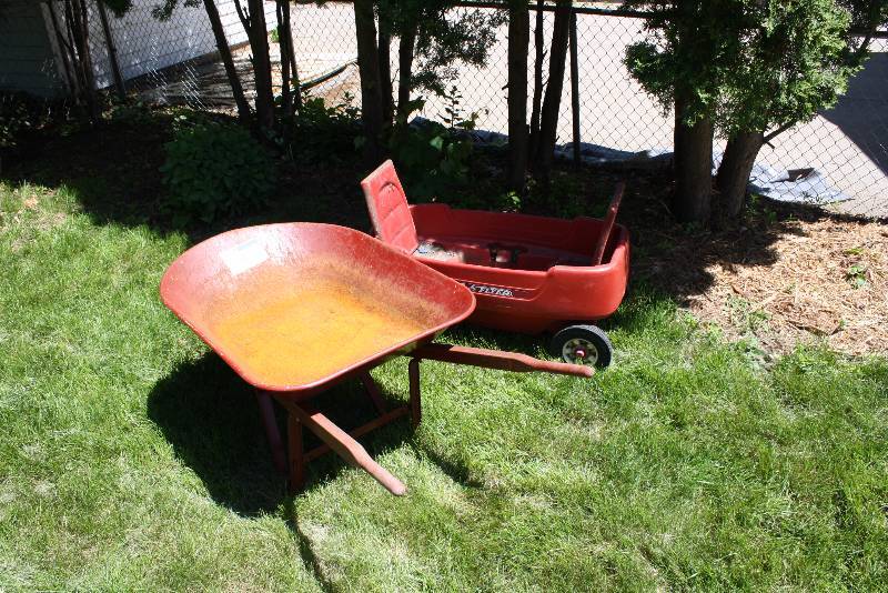 lot 19 image: Lot of (2) Radio Flyer Childrens Wagon, Plastic, Red, 18 x 37 True Temper Wheelbarrow wBucket, 27 x 36.