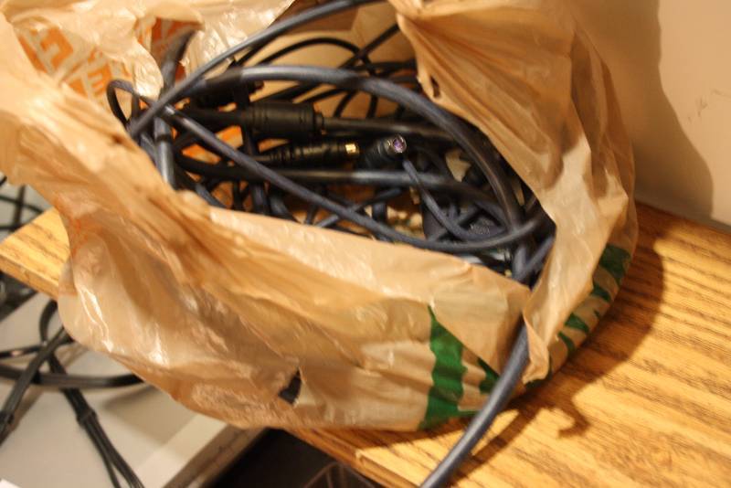 lot 52 image: Bag Lot Including Miscellaneous Cords Belkin Accessory And More.