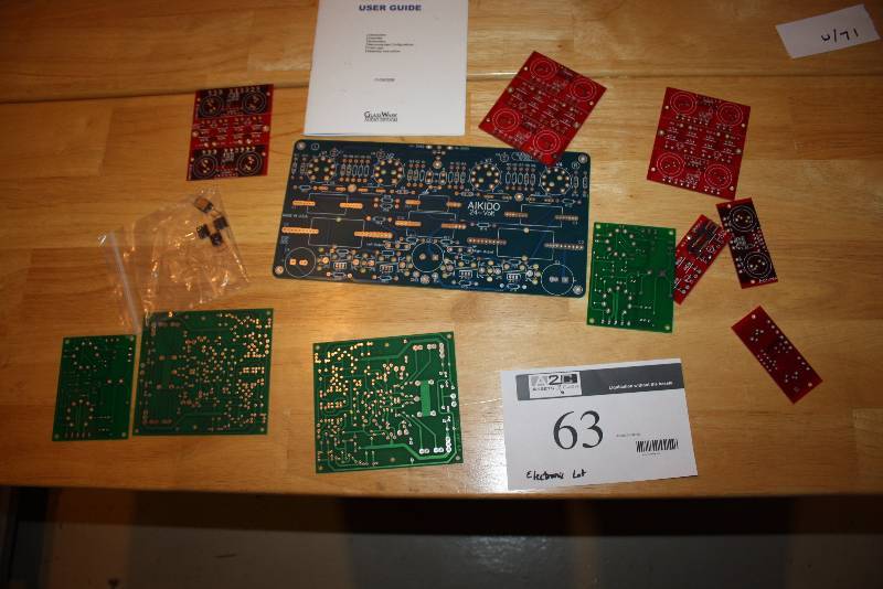 lot 63 image: Table Lot of Miscellaneous Computer Parts & Electronics Panels Includes Aikido Stereo HPA & LSA PCB User Guide.