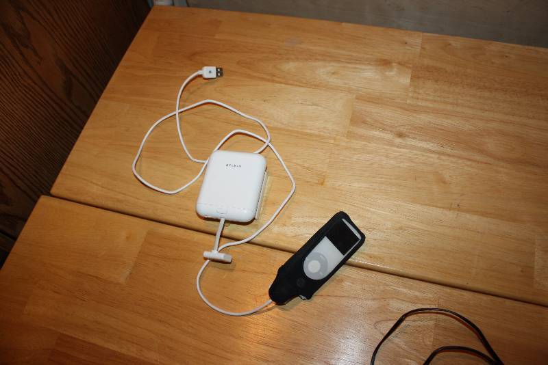 lot 59 image: Lot of (2) Including Belkin Back-Up Battery Pack For Ipod Ipod 4Gb wCase & Cords.