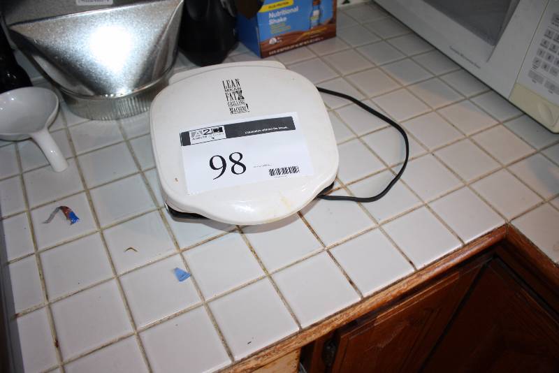 lot 98 image: George Foreman Grilling Machine Model GR-10A 120V.