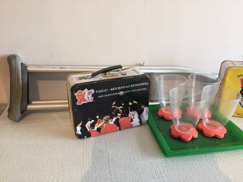 CRUTCHES,CUPS, GLASSES AND RED HAWKS LUNCH BOXES