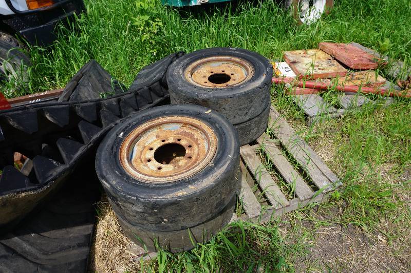 lot 49 image: Set of 4 Bobcat Skid Loader Skid Steer Solid Rubber Tires