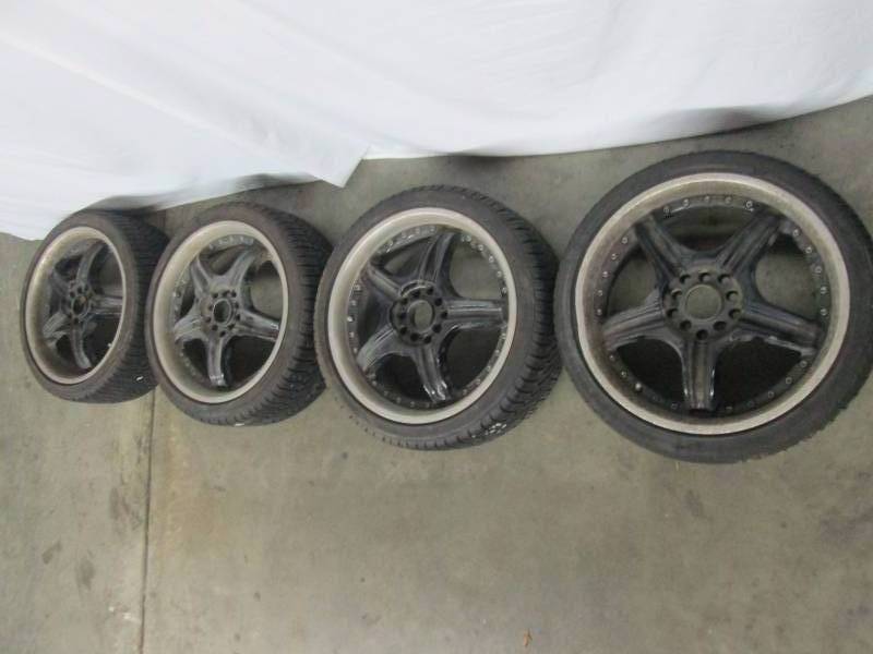 Four - 17 Black Rims and Tires