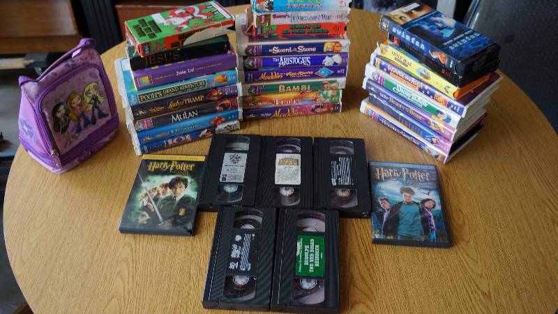 lot 185 image: Lot of VHS Tapes, DVDs & Lil Bratz Insulated Lunch Bag