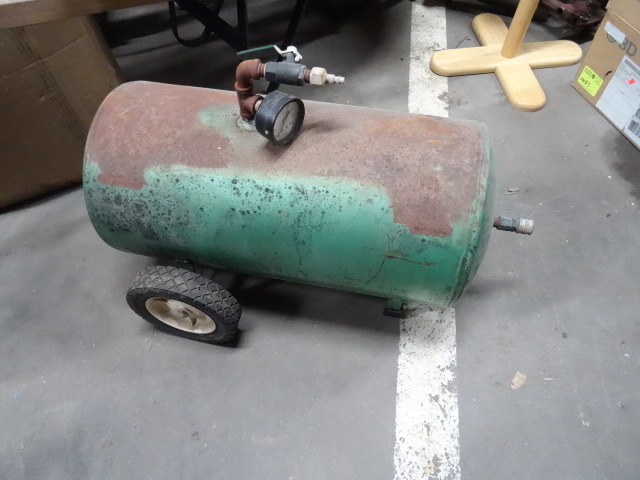 Portable air tank on wheels.