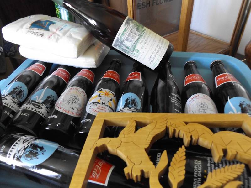 lot 410 image: North Dakota Collectible Coca Cola Bottles