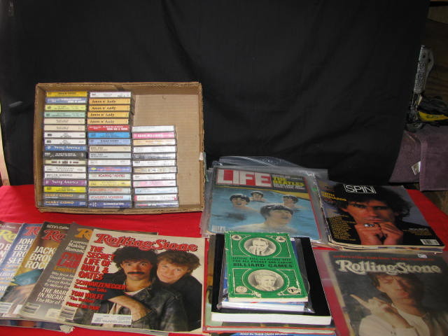large lot of cassette tapes and vintage rolling stone magazines