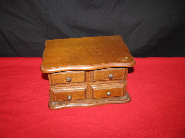 wooden jewelry box and the jewelry inside.