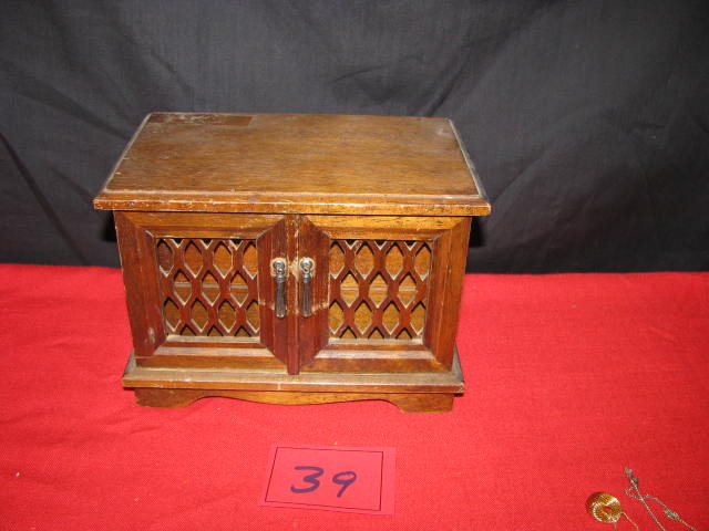 wooden jewelry box and the jewelry inside.