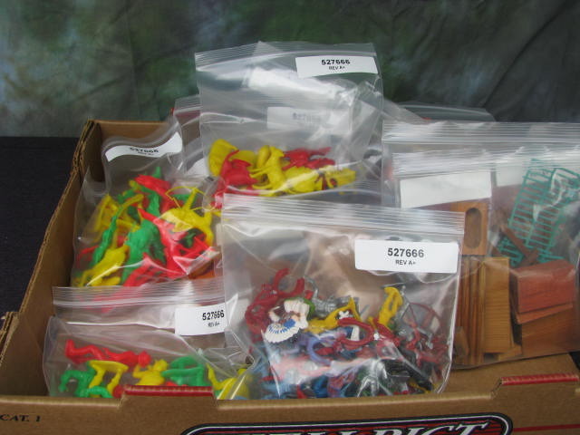 large lot of toy cowboy and indians and animals
