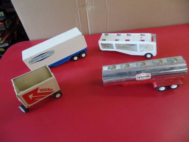 lot 102 image: 4 Tonka Truck Attachments