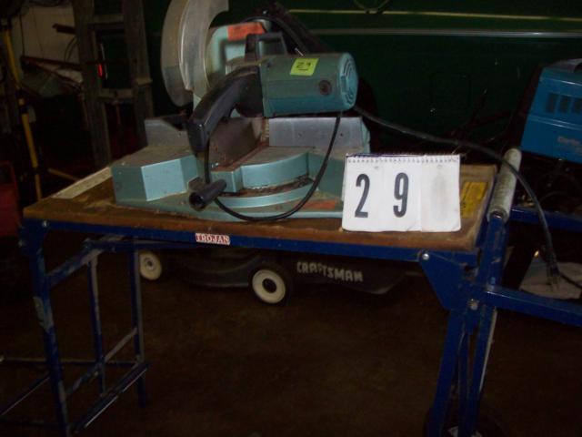lot 29 image: Hitachi 10 Compound Mitre Saw Model# C10FC on Trojan Rolling Expandable Saw Table, With Blades