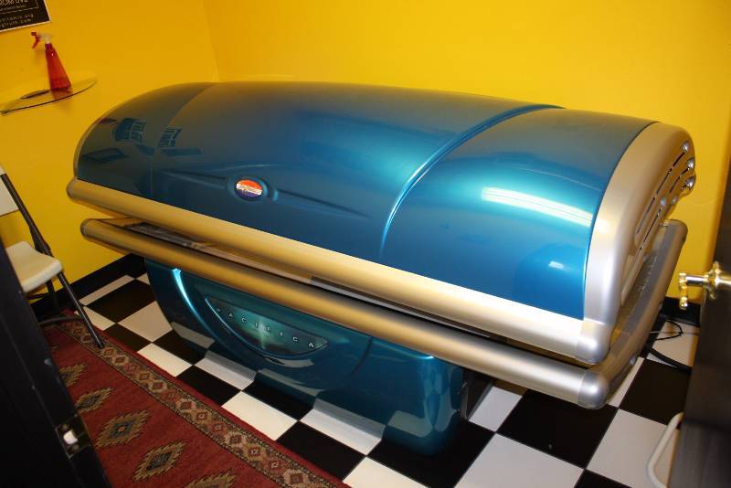 lot 6 image: Room Lot Including Tan America Pacifica Tanning Booth 4149 Hours Canopy Style Curved WCords Dimensions Tanning Bed 89 x 47 x 40 Decorative Floor RunnerRug, 84 x 24 Glass Shelf 25 x 8 Wall Mount Garbage Can 14 x 7 x4