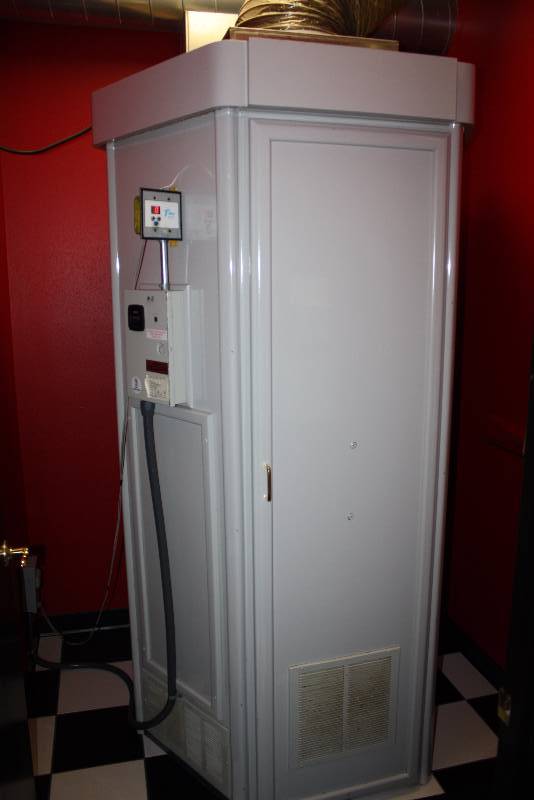 lot 11 image: Room Lot Including UprightStanding Tanning Booth wOverhead Light, Speakers & 8 Bulb Panels3729.4 Hours WCords Dimensions Tanning Bed 48 x 44 x 93 Floor RunnerRug, 71 x 26 Glass Shelf 25 x 8 Wall Mount Garbage Can 14 x 7 x4