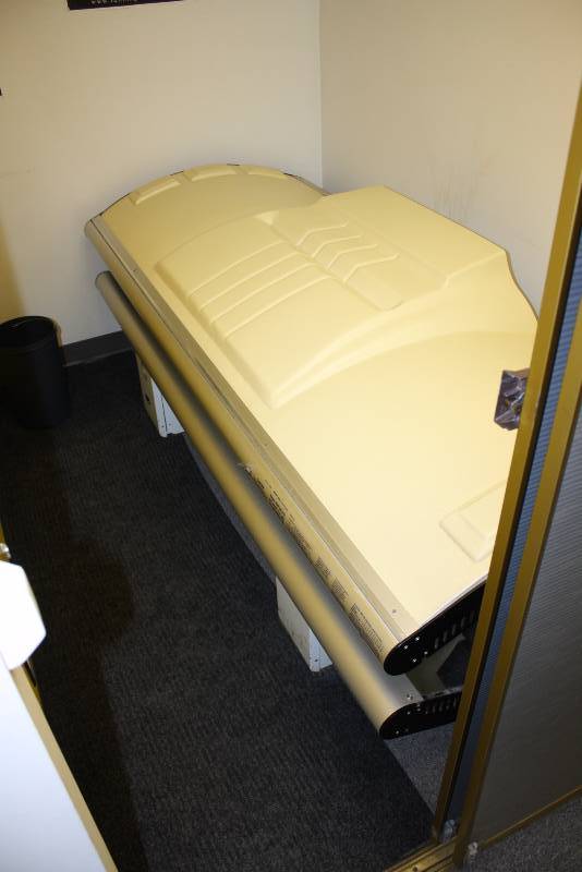 lot 21 image: Room Lot Including Puretan California 30 Tanning Bed 4620W 7682 Hours Canopy Style Curved WCords Dimensions Tanning Bed 89 x 35 x33 Wooden Shelf 24 x 7 Wall Mount Garbage Can 14 x 7 x4 Speakers, 5.5 x 3.5 (2) Rug 89 x 26.