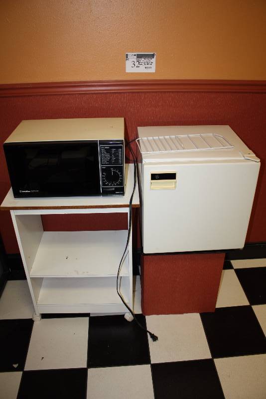 lot 32 image: Lot of (4) Including Gold-Star Microwave, 19 x 12 x 10 Mini-Fridge 19 x 18 x 19 Cart 24 x 16 x 30 Table 16 x 15 x 20.