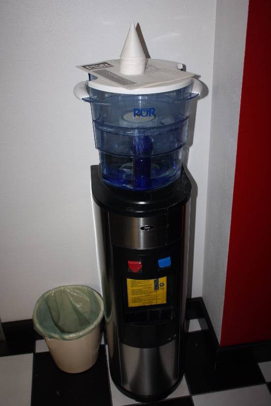 lot 47 image: Pur 100110 Advanced Filtering Water Bottle wDispensing Stand 12 x 12 x 48 Includes Garbage Cans.